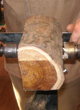 Log carefully mounted between centres